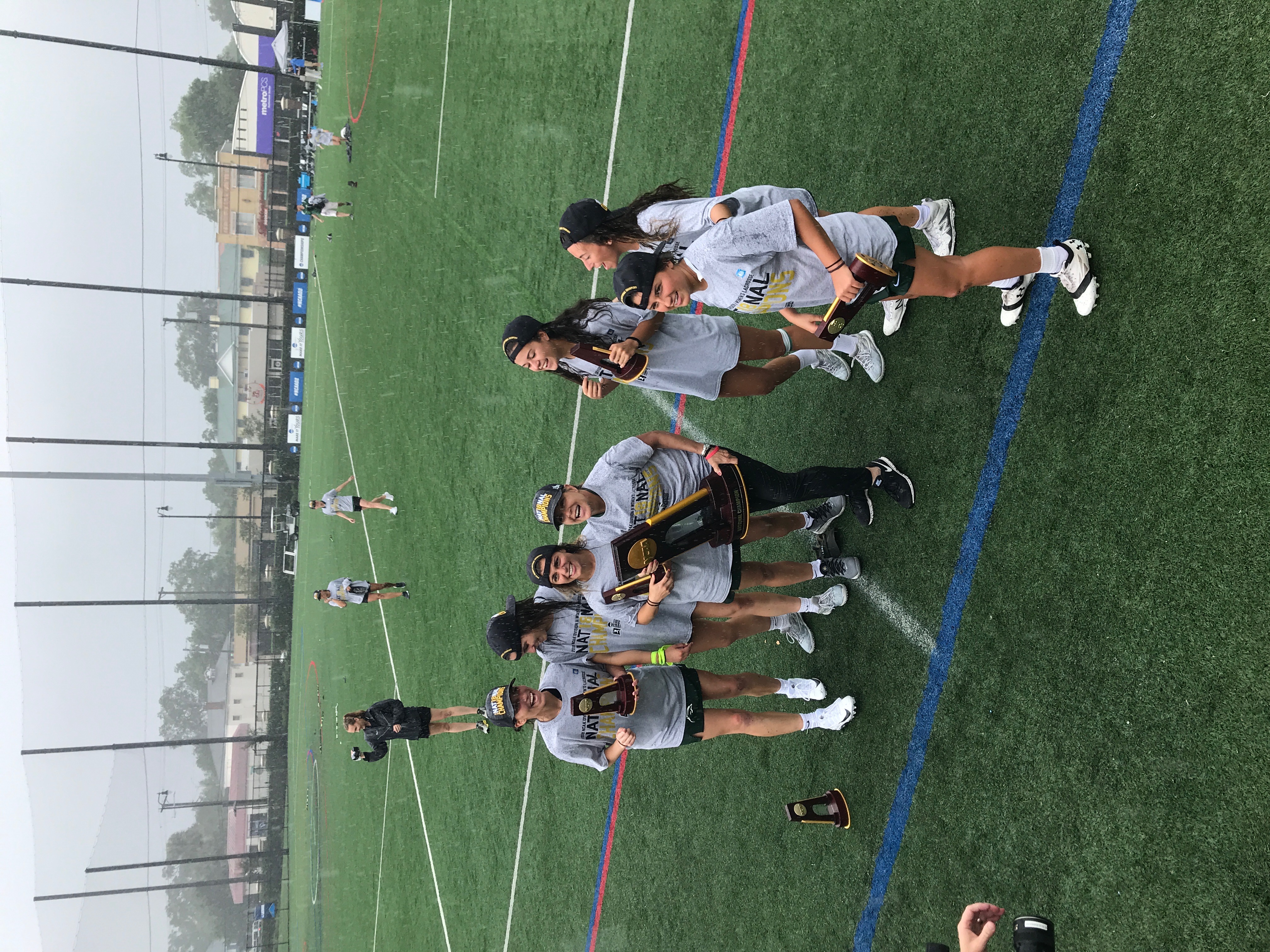 Kathy Taylor and Le Moyne players celebrating the 2018 NCAA Division II National Championship